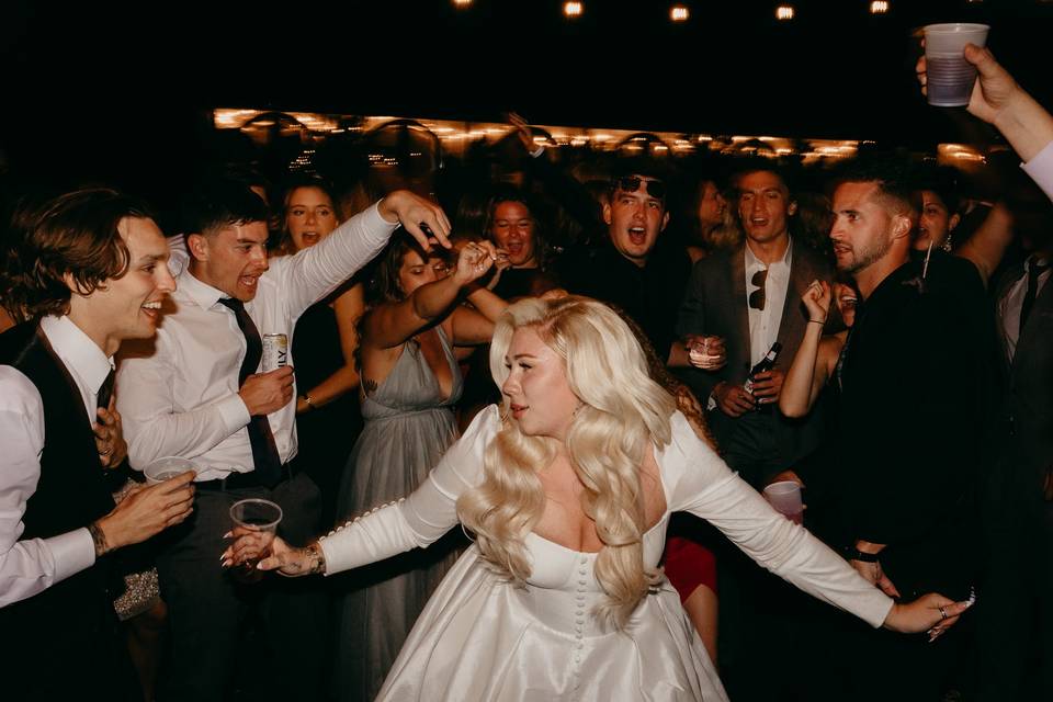 Reception dancing by bride
