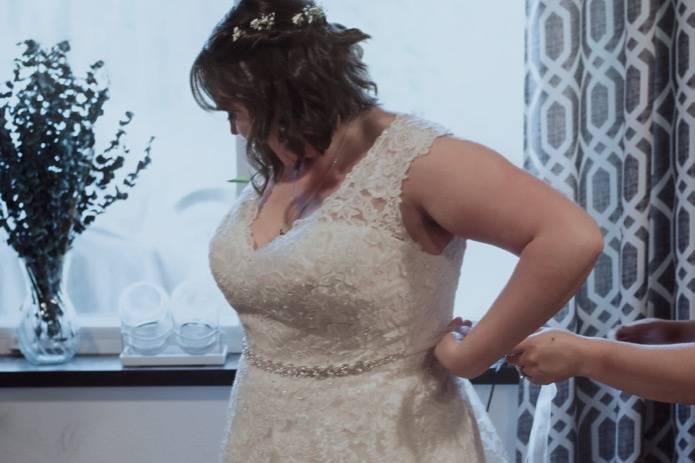 Buttoning the dress