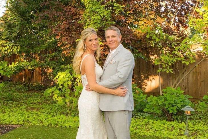 Bride and groom holding each other