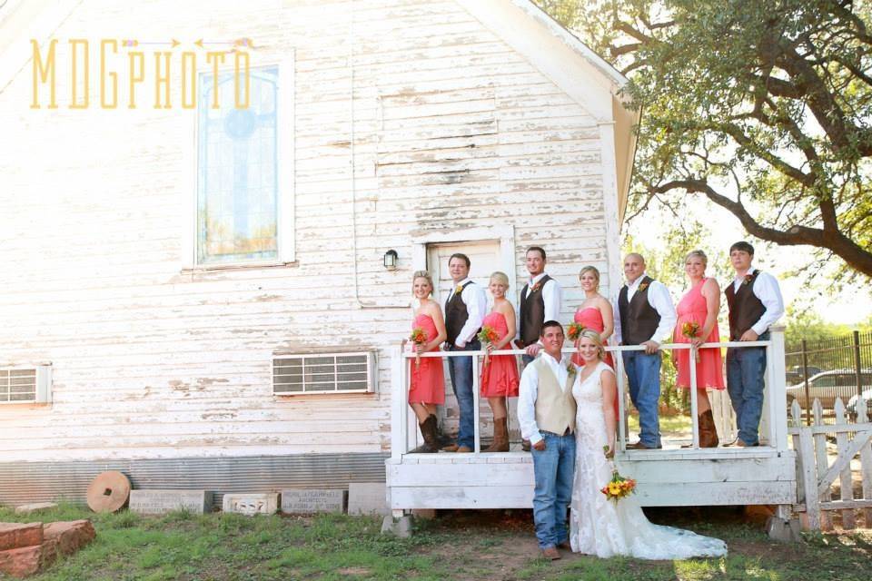 The couple with the bridesmaids and groomsmen