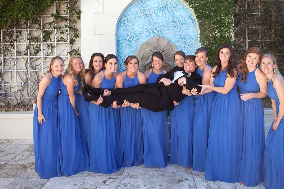 Groom Held up by Bridesmaids