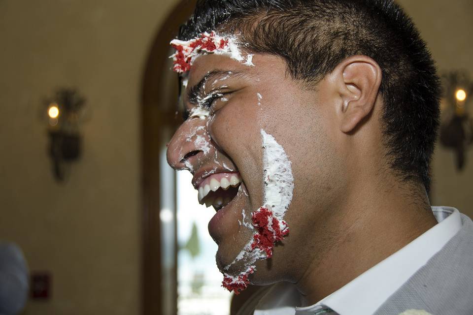 Groom with frosting on his Face