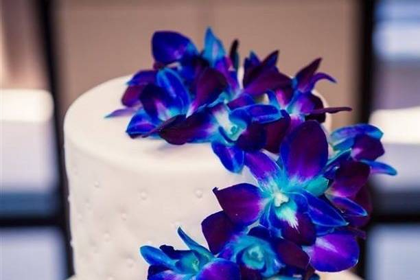 Blue orchids on cake