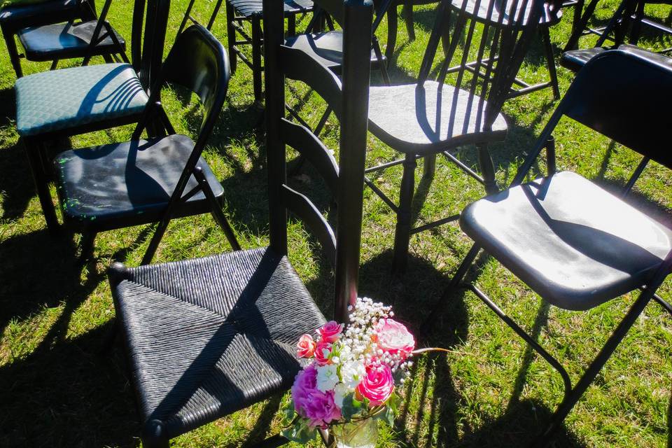 Random, mismatched chairs lend to the air of family and country.  Each guest was told to 