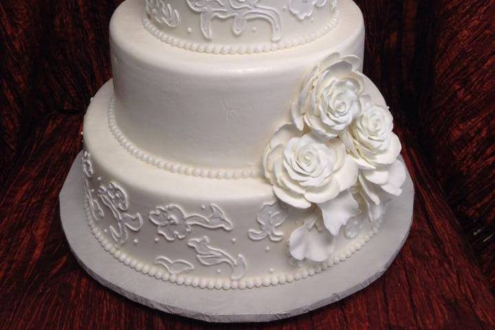 White wedding cake with flowers