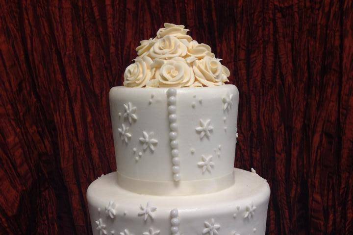 Wedding cake with flowers on top