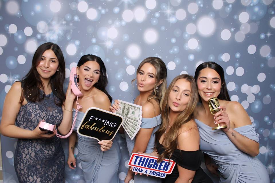 Brides enjoying the booth