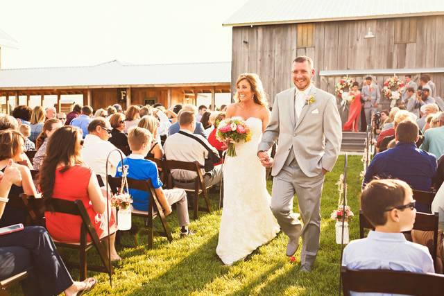 DCP outdoor wedding service in full sun rustic pastel vineyard.