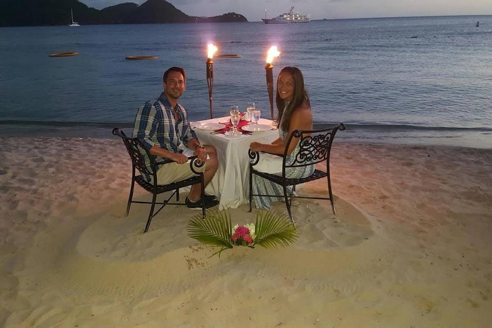 Romantic dinner setup at the beach
