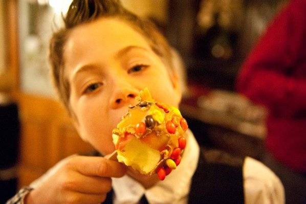 Young wedding guest enjoying the Candy Apples