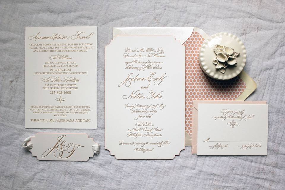 Dusty pink envelope lining with gold text