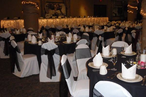 Chair covers with black sheer sashes
Brett Favres Steakhouse reception site  rental chair covers and sashes