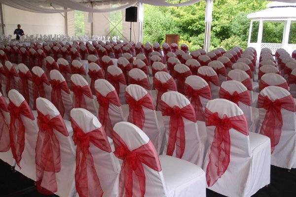 Chair covers with red sashes at the
SC Grand reception tent