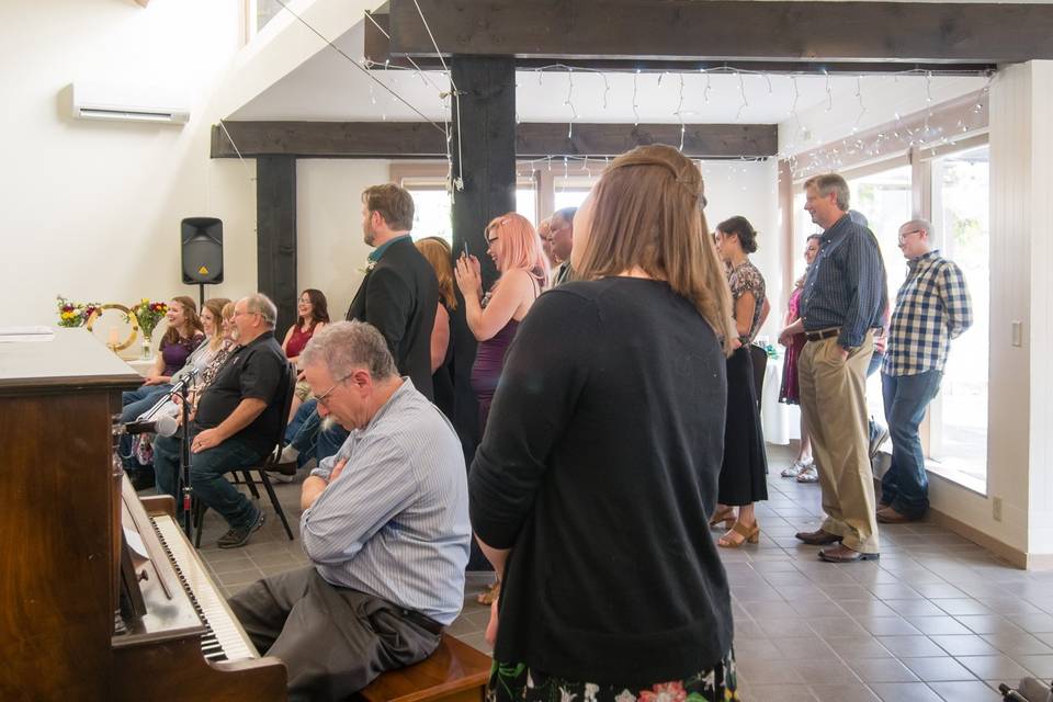 Some seated guests, some stand