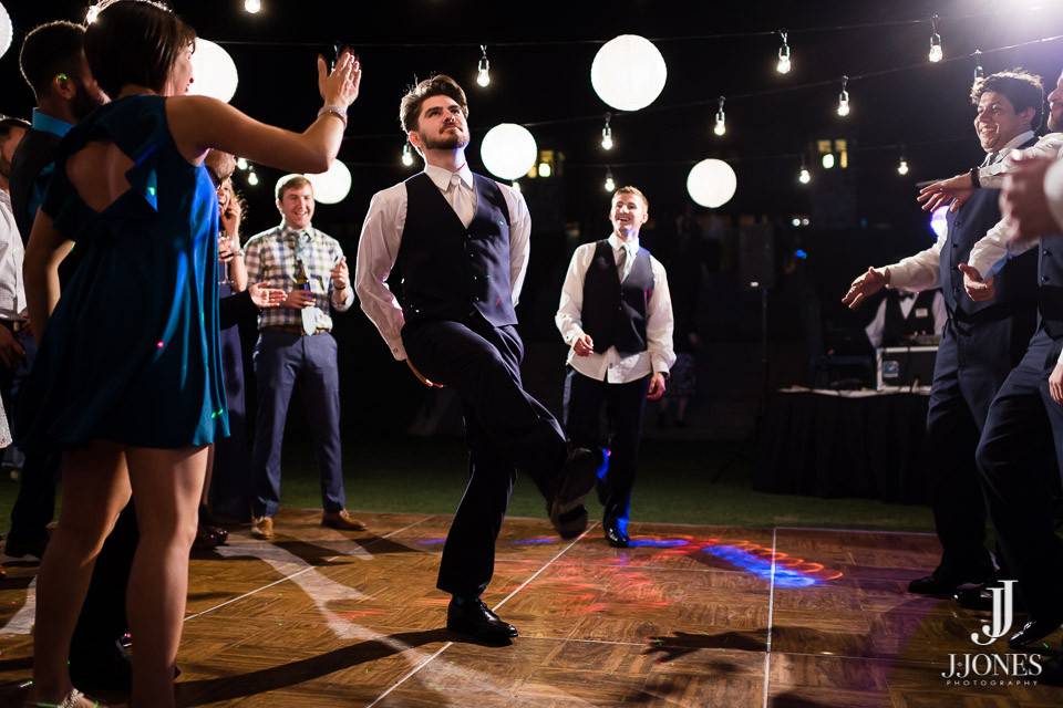 Groom dancing at the reception