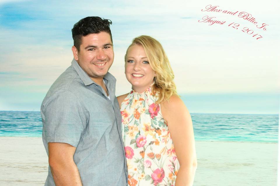 This photo background was provided by the bride. It is the beach on which they were married. During their Red Carpet time they had everyone have their photo on this background so it could be like they were on the beach in Mexico on their wedding day.
