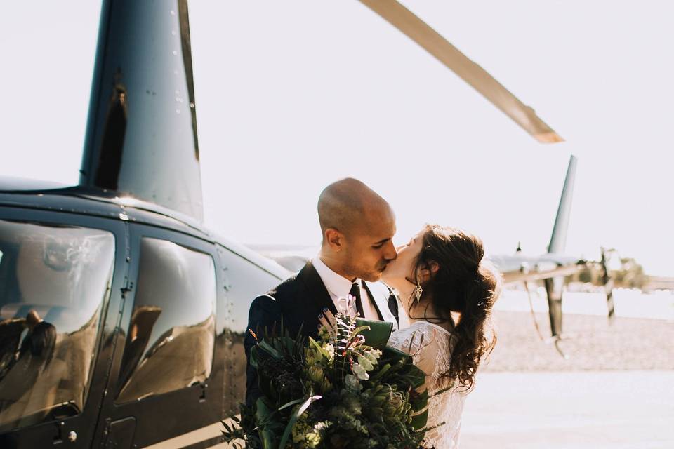 The couple by a helicopter