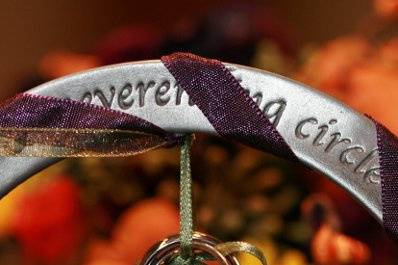 Alternative to the ring pillow - an engraved pewter ring wrapped in wedding colors.