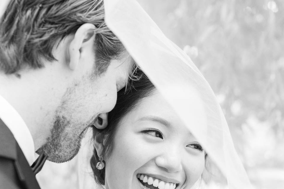 Bride laughing with wedding party