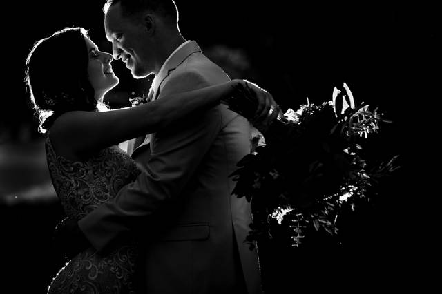 Backlit bride and groom