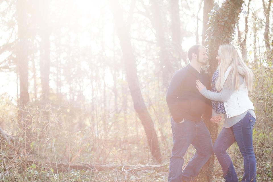 Happy couple posing in forest