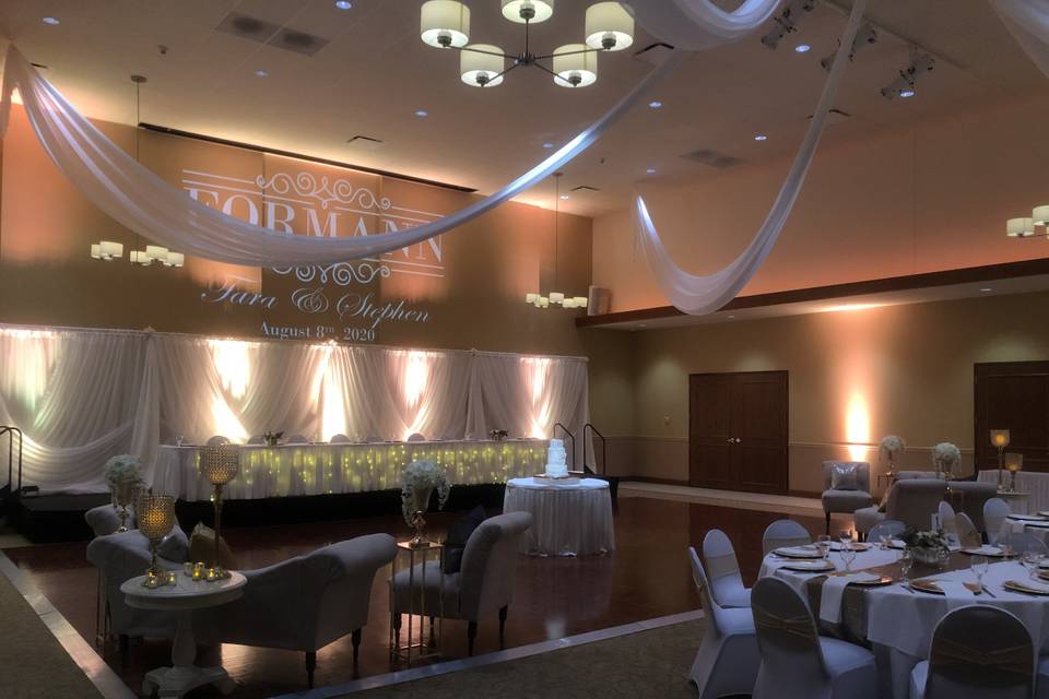 Draped Head table and florals