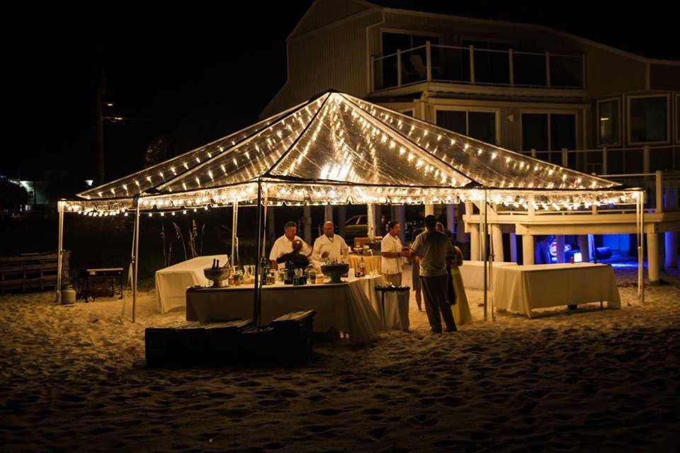 A Marry Me Rentals clear view tent and cafe lighting is very romantic