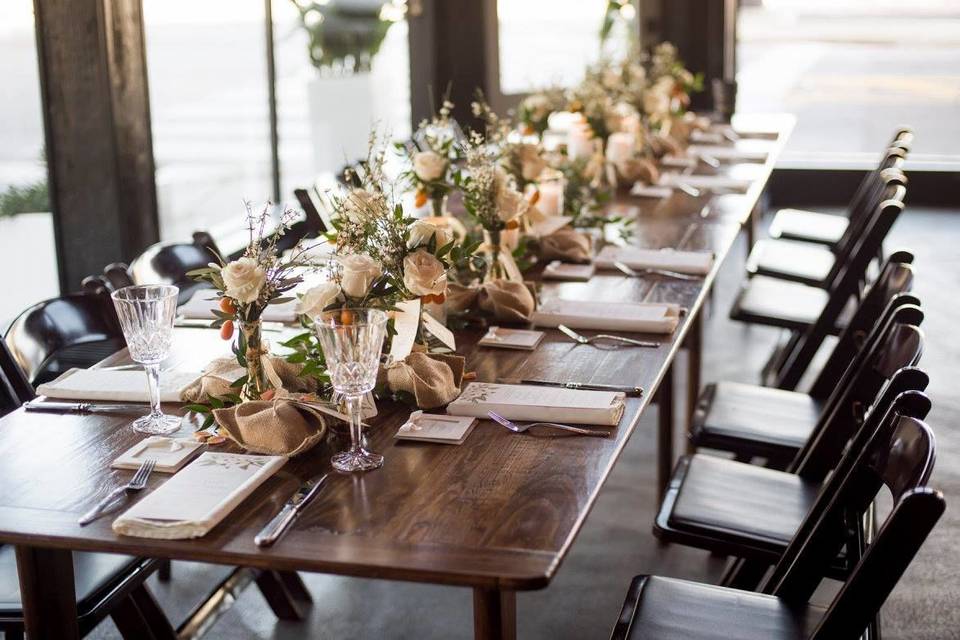 Farm tables with mahogany garden chairs for a ladies luncheon.