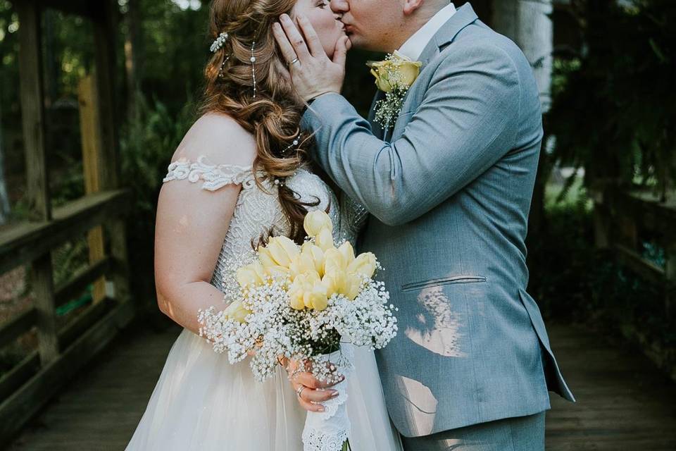 Beautiful bride kissing her partner