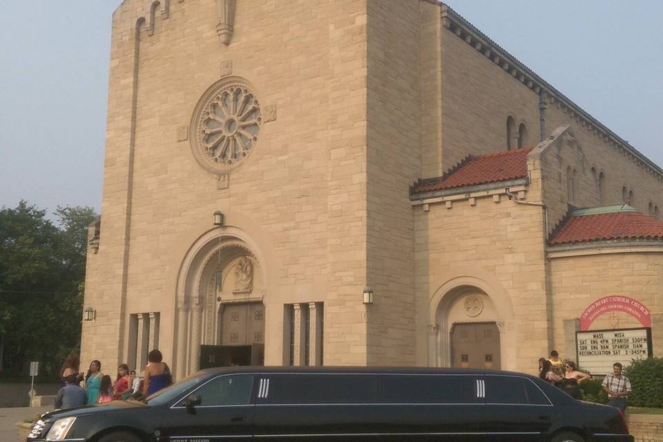 Our 10 passenger Cadillac DTS limousine dropping the wedding party off at a beautiful church in the city!