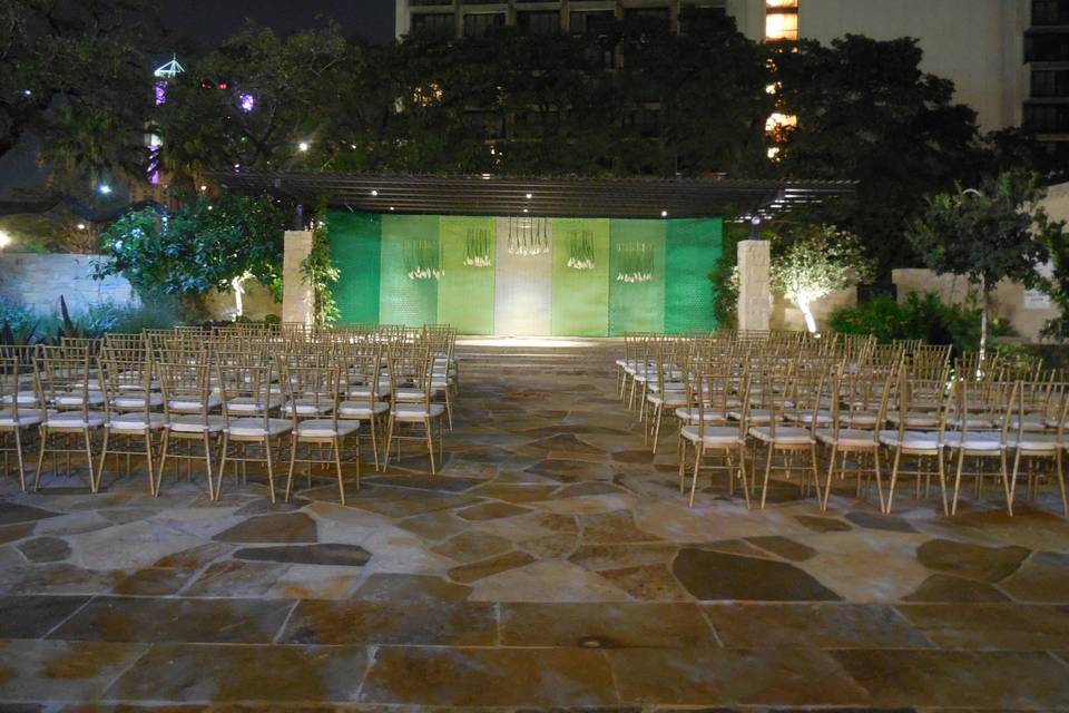 Outdoor Evening Wedding Ceremony at our McNutt Courtyard and Sculpture Garden.