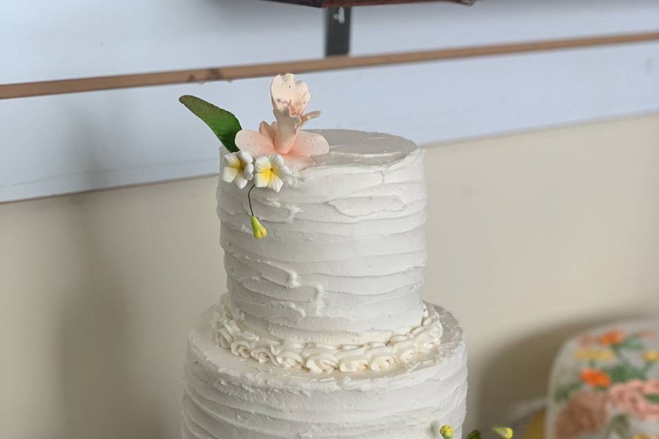 Buttercream ruffles & orchids.