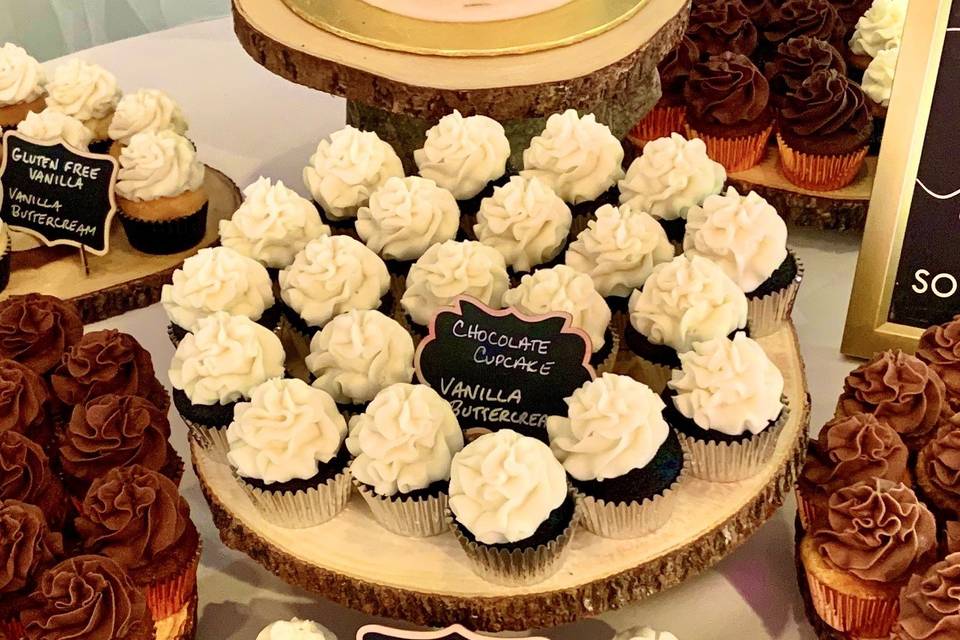 Cutting cake with cupcakes