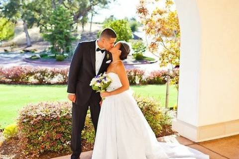 Couple kissing on the veranda