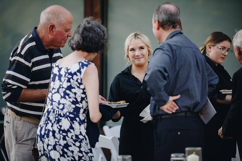 ACT 3 Staff passing appetizers