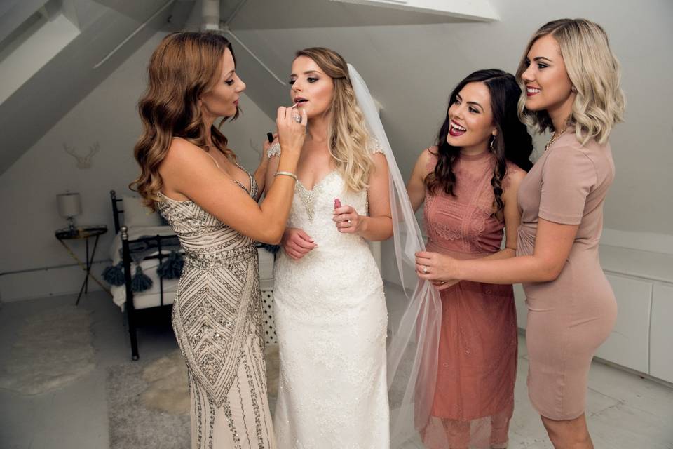Supportive bridal party getting ready
