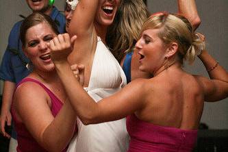 Dancing bride and bridesmaids