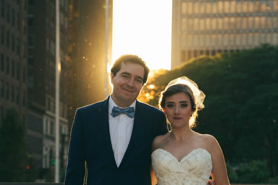 Happy couple standing in sunshine