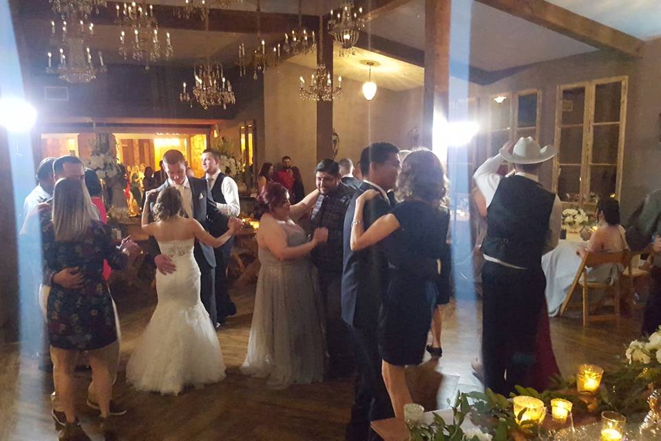 Newlyweds and guests on the dance floor