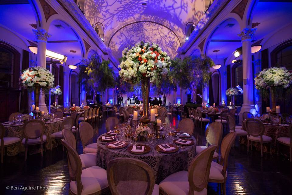 Round tables were adorned with tall lush florals