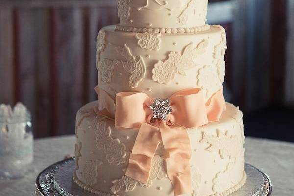 3-tier cake with blush ribbon