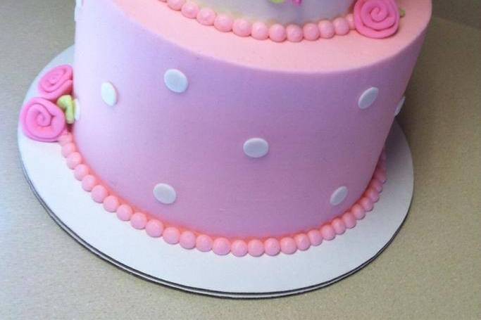 2-tier white and pink cake