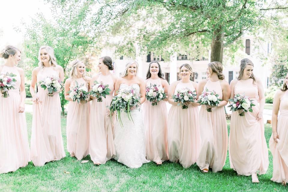 Bride, bridesmaids, and their bouquets