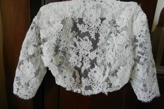 Back of Custom Alencon re-embroidered lace bolero modesty jacket. All lapped seams, designed to  be tucked in the top of a strapless gown.