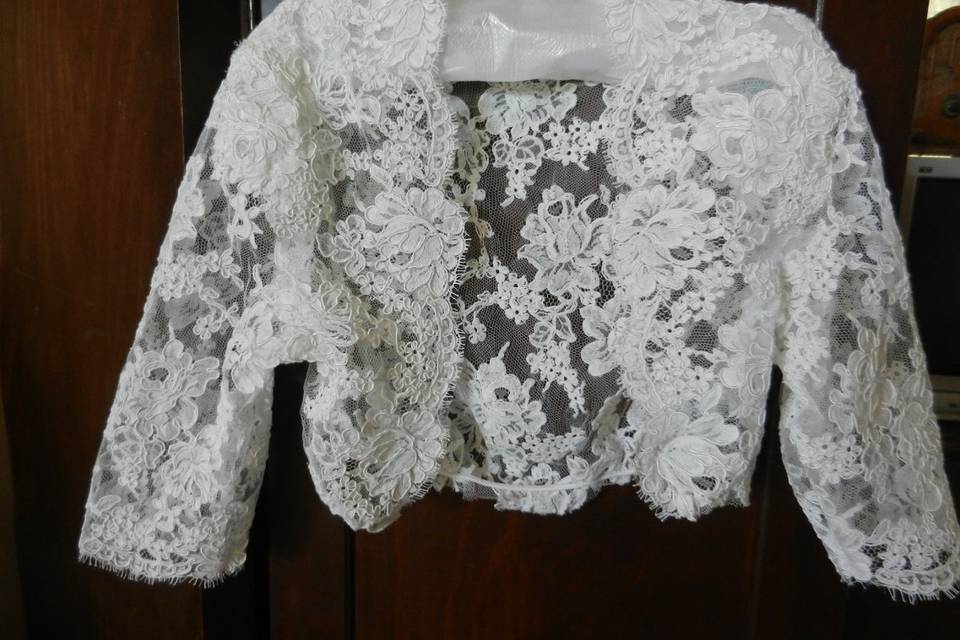 Front of Custom Alencon re-embroidered lace bolero modesty jacket. All seams are lapped, assembled by hand, with elbow length sleeves.