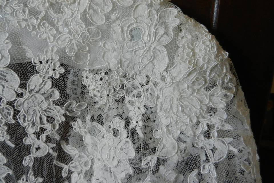 Close-up of shoulder area (showing lapped seams) of custom Alencon re-embriodered lace bolero jacket.