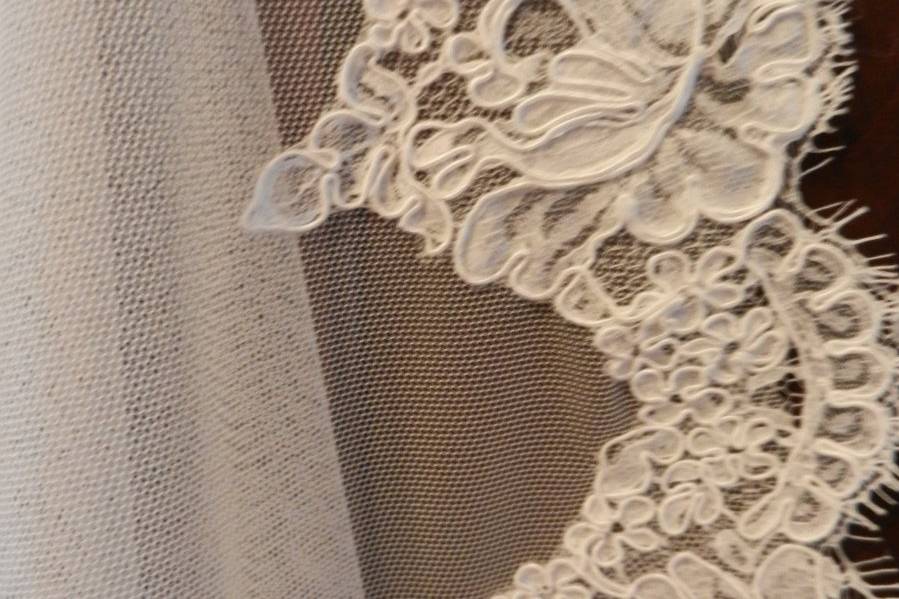 Close-up of alencon re-embroidered lace edging