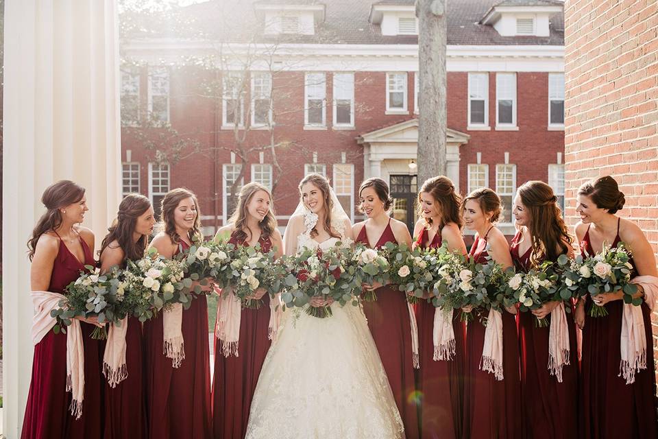 Bridesmaids on steps of chapel