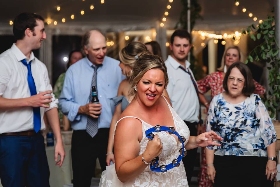 Candid bride dancing