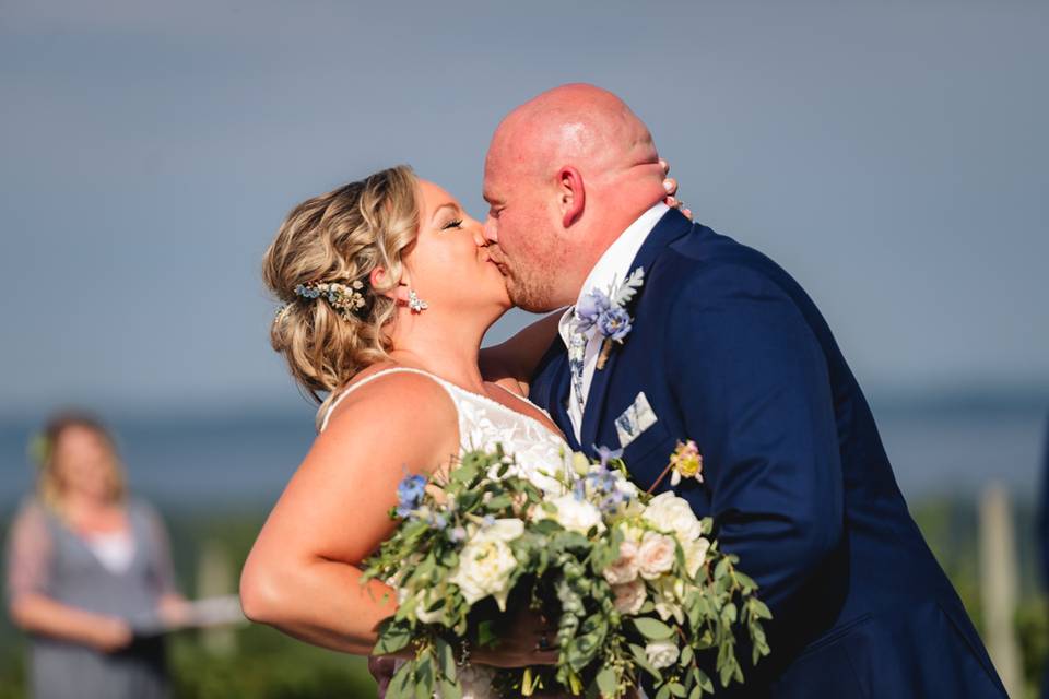 Newlyweds kiss at the ceremony